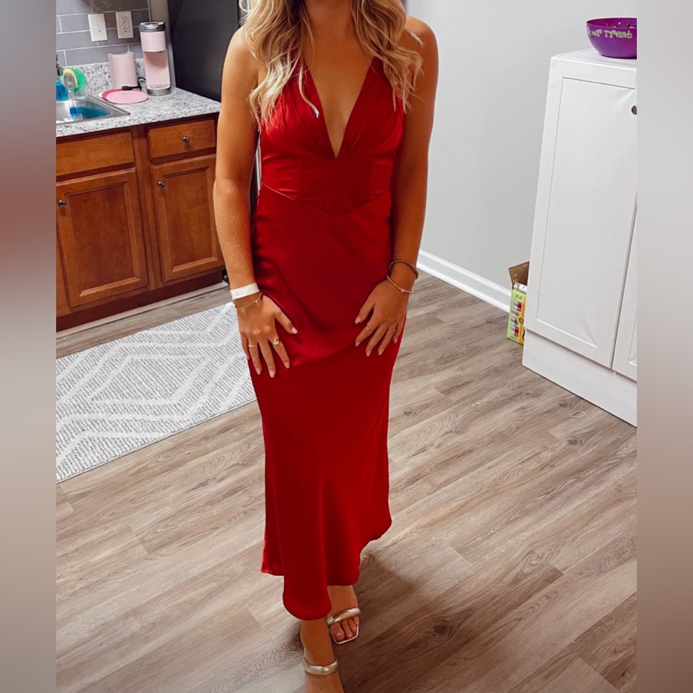Long red formal dress with an open back and v-neck that ties in the back, size S